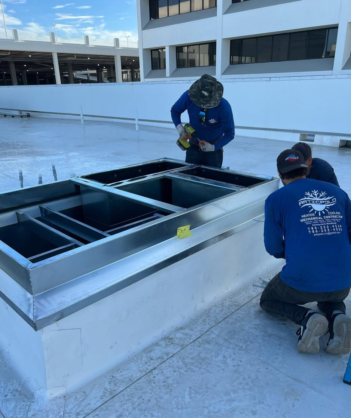 Articpolo technician working on an AC unit
